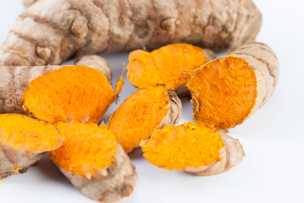 istock Turmeric roots isolated on white background 675518294