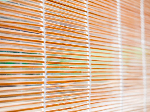 istock Close up Woven Wood or Bamboo curtain window background, selective focus. 675519290