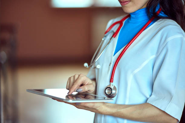 istock Doctor working on a digital tablet with copy space 675522086