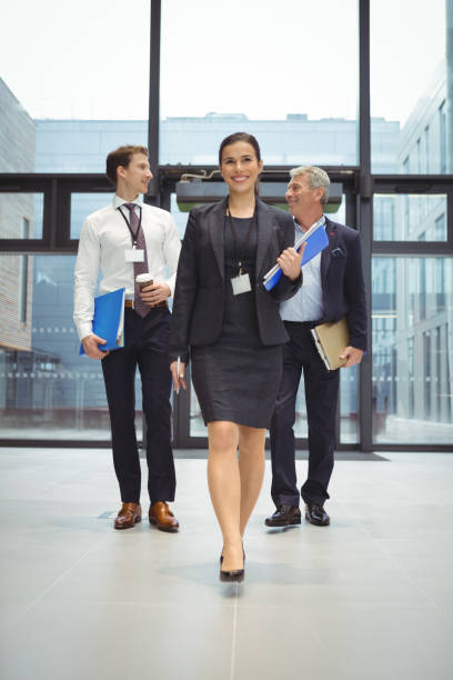 istock Businesspeople walking together with file 675529956