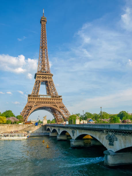 istock Eiffel Tower and bridge over river in Paris 675530366