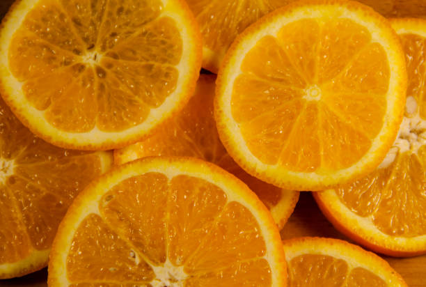 istock Background of sliced juicy oranges fruit 675536246