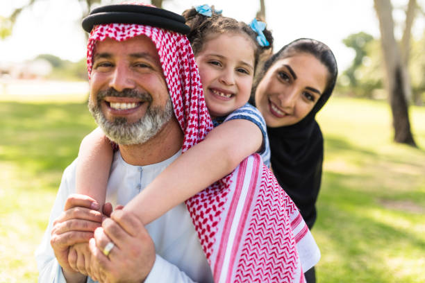 happy saudi arabian family in the park happy saudi family in the park riyadh photos stock pictures, royalty-free photos & images