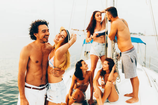 istock Happy friends on a yacht 675541026