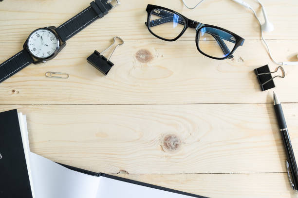istock workspace border with notebook and stationery and equipmenttop top view with copy space 675544004