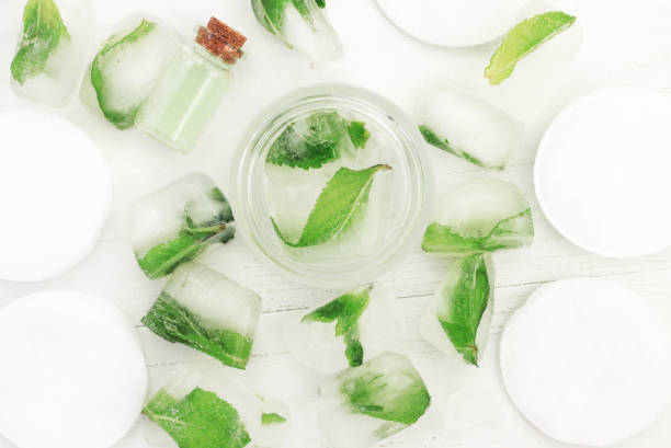 istock Top view on herbal ice cubes frozen with fresh mint herb. 675546556