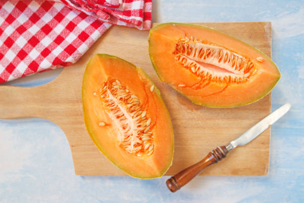 istock Tasteful fresh melon fruit slices on the table 675550772