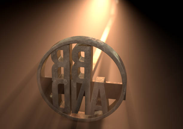 A metal cattle branding iron with the word brand as the marking area backlit by a bright light - 3D render