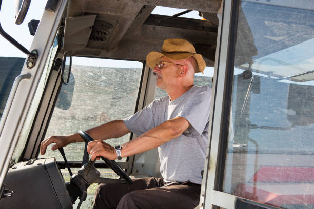 istock Farmer driving tractor with dirty windshield 675563486