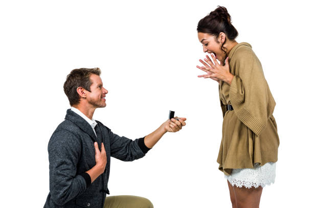 istock Happy man offering engagement ring to partner 675570300