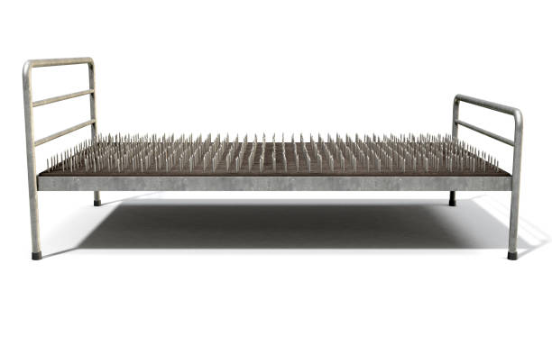 Bed Of Nails Isolated A metaphor showing a literal bed of nails with a metal frame on an isolated white studio background - 3D Render bed of nails stock pictures, royalty-free photos & images