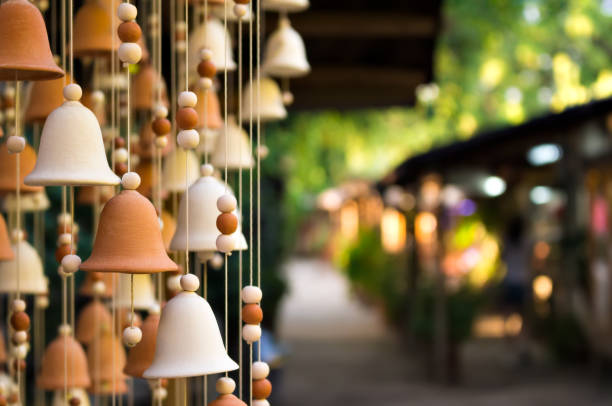 Hand made wind chimes hanging on a string stock photo