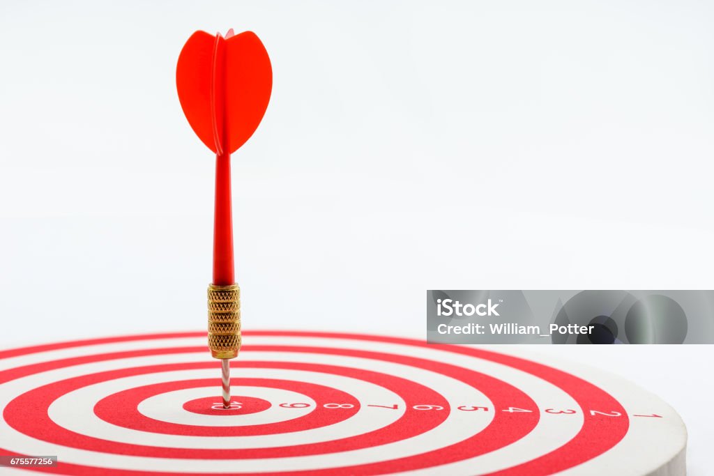 Circular target marked with numbers and red dart. Circular target marked with numbers and red dart. An idea of targets i.e business, price, audience, market, group, practice, analysis, risk, range, rate, state, tracking, area, value, cost, site, etc. Sports Target Stock Photo