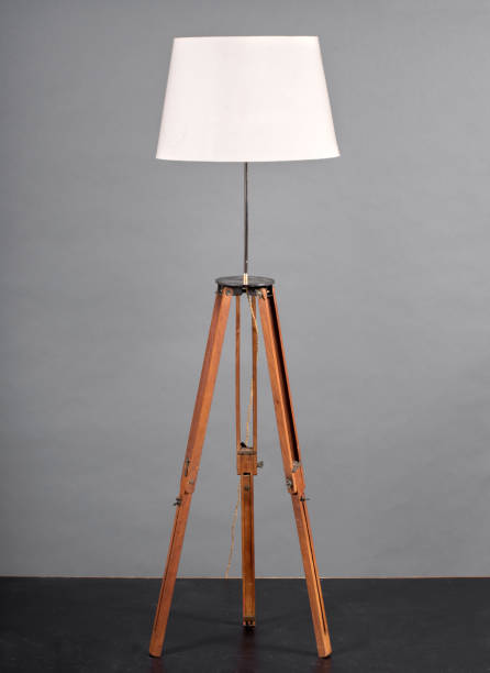 istock Vintage wooden tripod lamp 675579658