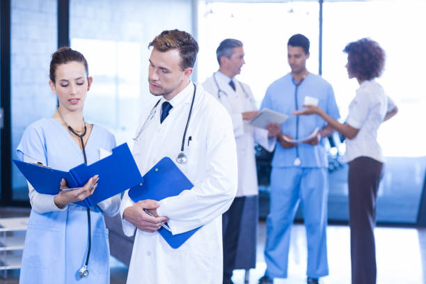 istock Doctors looking at medical report 675586440