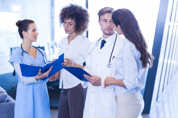 istock Doctors looking at medical report 675586486