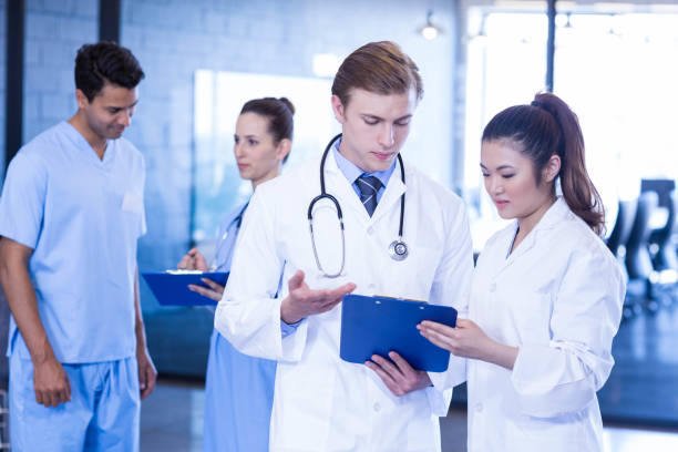 istock Doctors looking at medical report 675587240