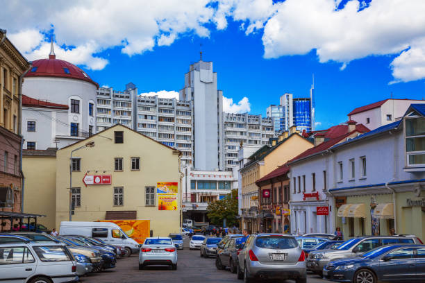 Minsk, Belarus, Nemiga Street, Trading House on blue sky background and old architecture on Komsomolskaya Street, 10.06.2015, Editorial