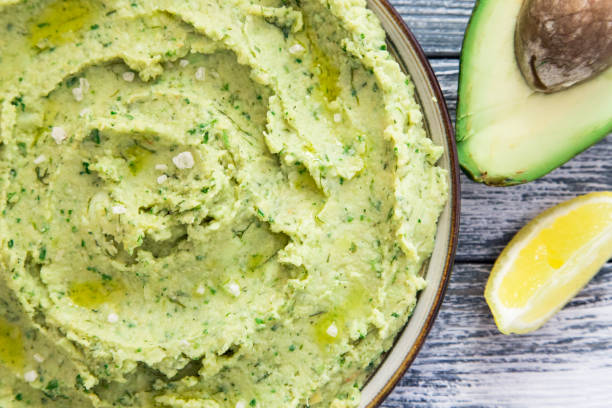 istock Healthy avocado hummus with olive oil. vegetarian concept. selective focus 675597500