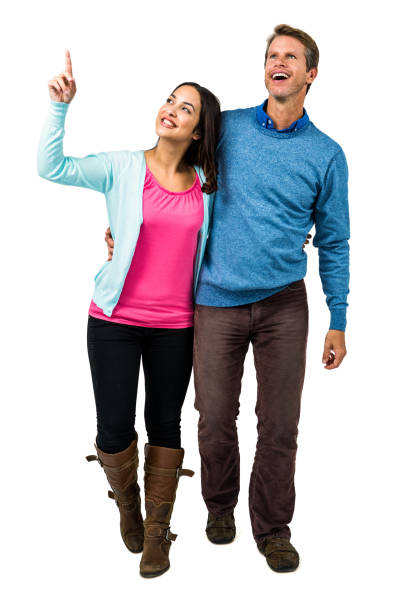 Full length portrait of affectionate mature couple together over white background