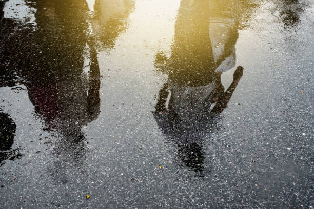 istock Puddle of water in rain - selective focus 675620354