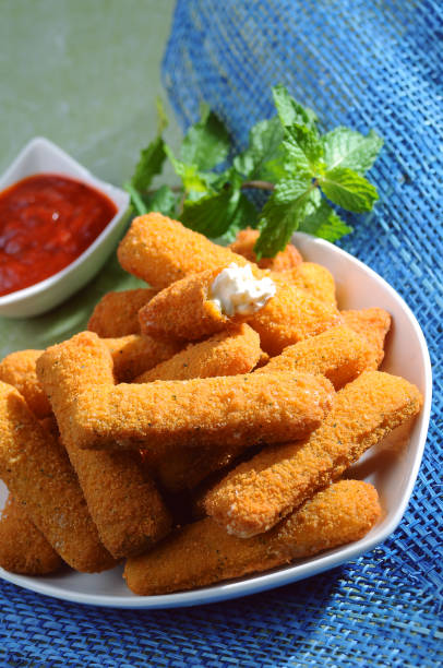 istock Breaded fried cheese fingers with mint & Ketchup 675620772