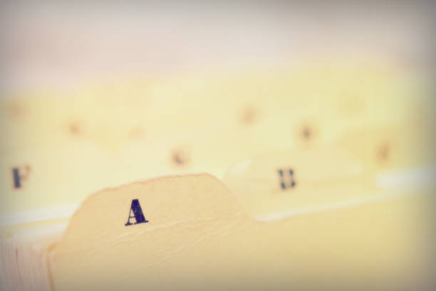 istock Close up of alphabetical index cards in box 675624086