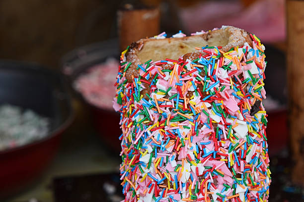 istock Close-Up Of Candies Around Spit Cake 675628259