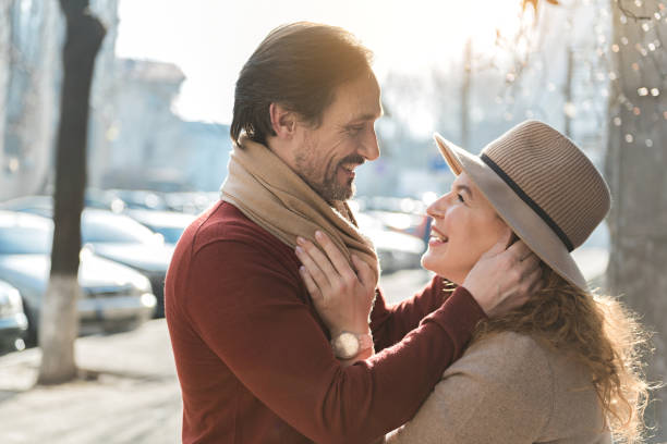 istock Happy mature couple enjoying hug outside 675630054