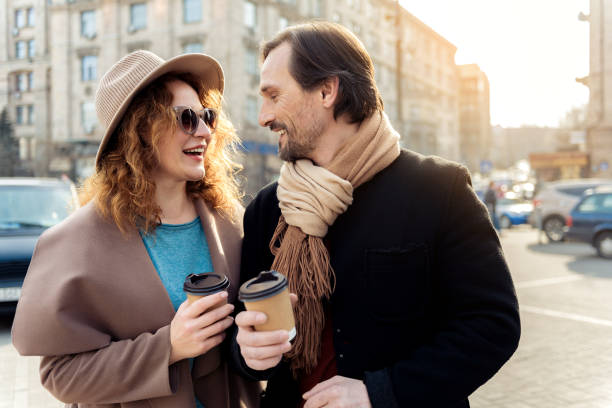 istock Cute couple warming up by hot beverage and love 675630678