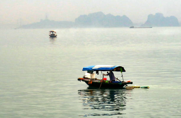 istock fishing boat, Ha Long Bay, Vietnam 675635342