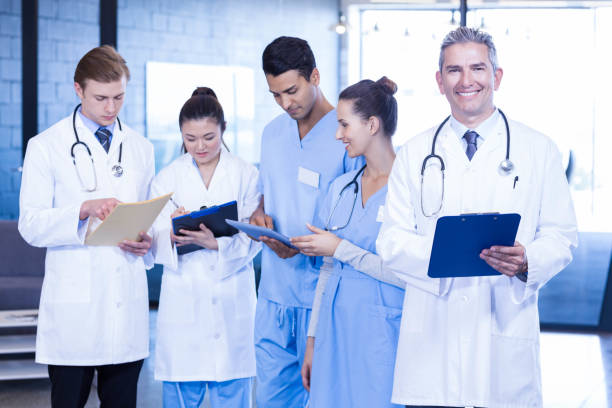 istock Doctors examining medical report 675638892