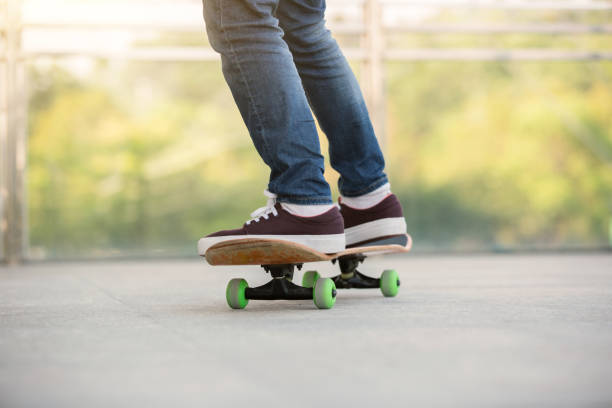 istock skateboarder legs skateboarding at skatepark 675641296