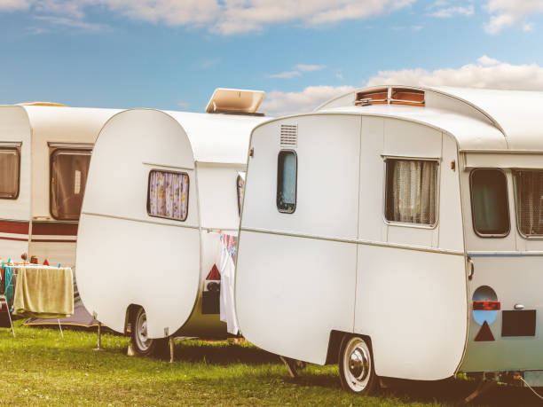 istock Row of three vintage restored caravans 675642094