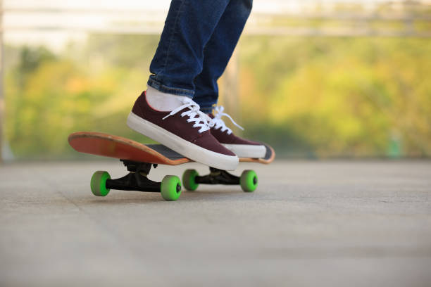 istock skateboarder legs skateboarding at skatepark 675642310