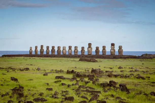 Famous Ahu Tongariki, all fifteen standing Moai Statues side by side in a row in late afternoon light. Easter Island, Isla de Pascua, Polynesia, Chile, Oceania