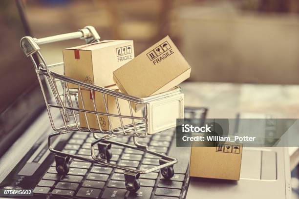 Paper Boxes In A Shopping Cart Stock Photo - Download Image Now - Merchandise, Buying, Retail