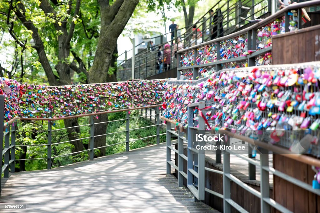 A lock fence pledging love Metal, key, fence, couple, devotion, love, oath, Affectionate Stock Photo