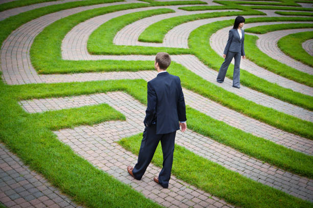 istock Problem Solving Business People in a Maze with Deadline Time Management 675653168