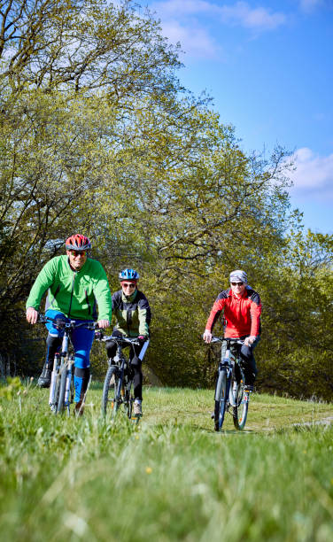 istock Walking a bike through the forest in the spring. 675659052