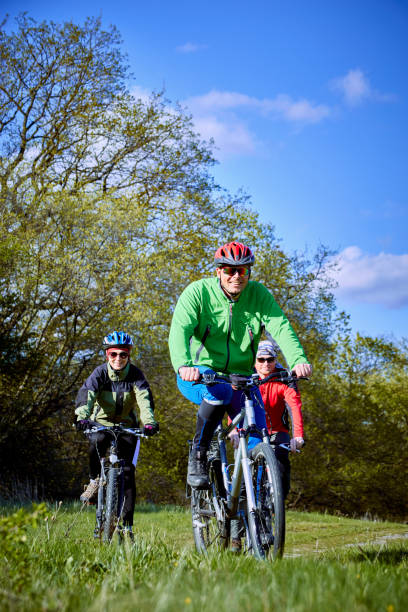 istock Walking a bike through the forest in the spring. 675659060