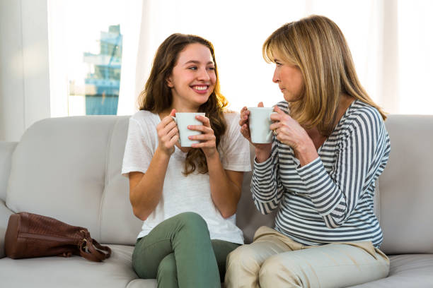 istock Mother and daughter drinking tea 675665014
