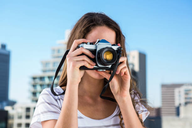 istock Young girl taking photos 675668502