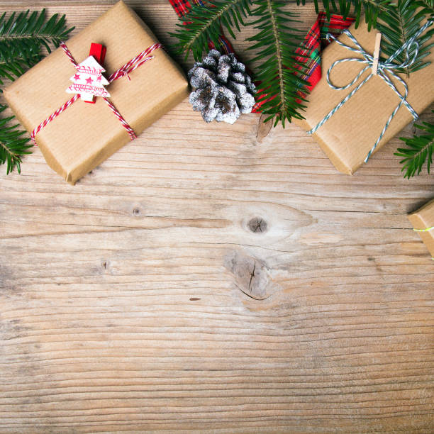 istock Christmas presents on wooden background, retro style with copy space 675674192