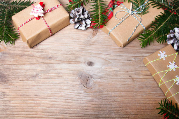 istock Christmas presents on wooden background, retro style with copy space 675674656