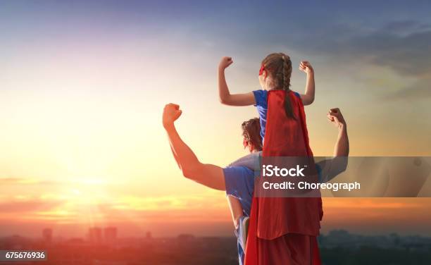 Dad And His Daughter Playing Outdoors Stock Photo - Download Image Now - Father, Superhero, Heroes