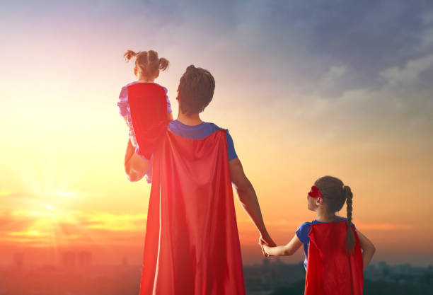 istock Dad and his daughters are playing 675676952