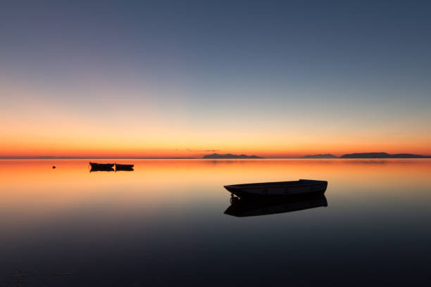 istock A warm sunset on a calm water 675680074