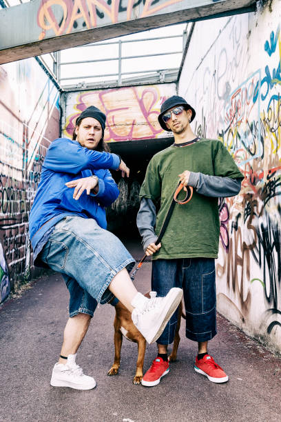 istock two rap singers with a dog in a subway with graffiti in the background 675680642