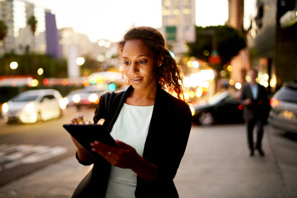istock Digital tablet at night in the city. 675680978